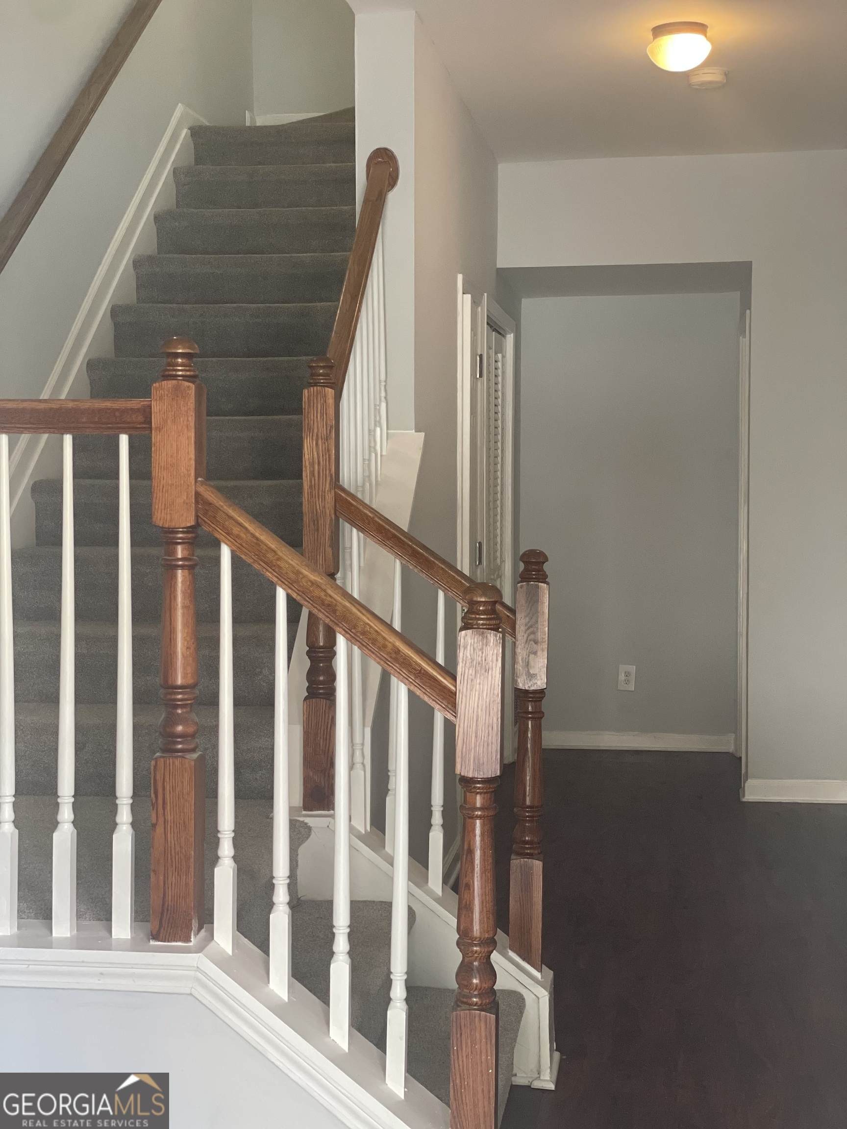 3640 Utoy Drive Southwest South Fulton, GA 30331 - Photo 4 of 26 a view of staircase with railing and white walls