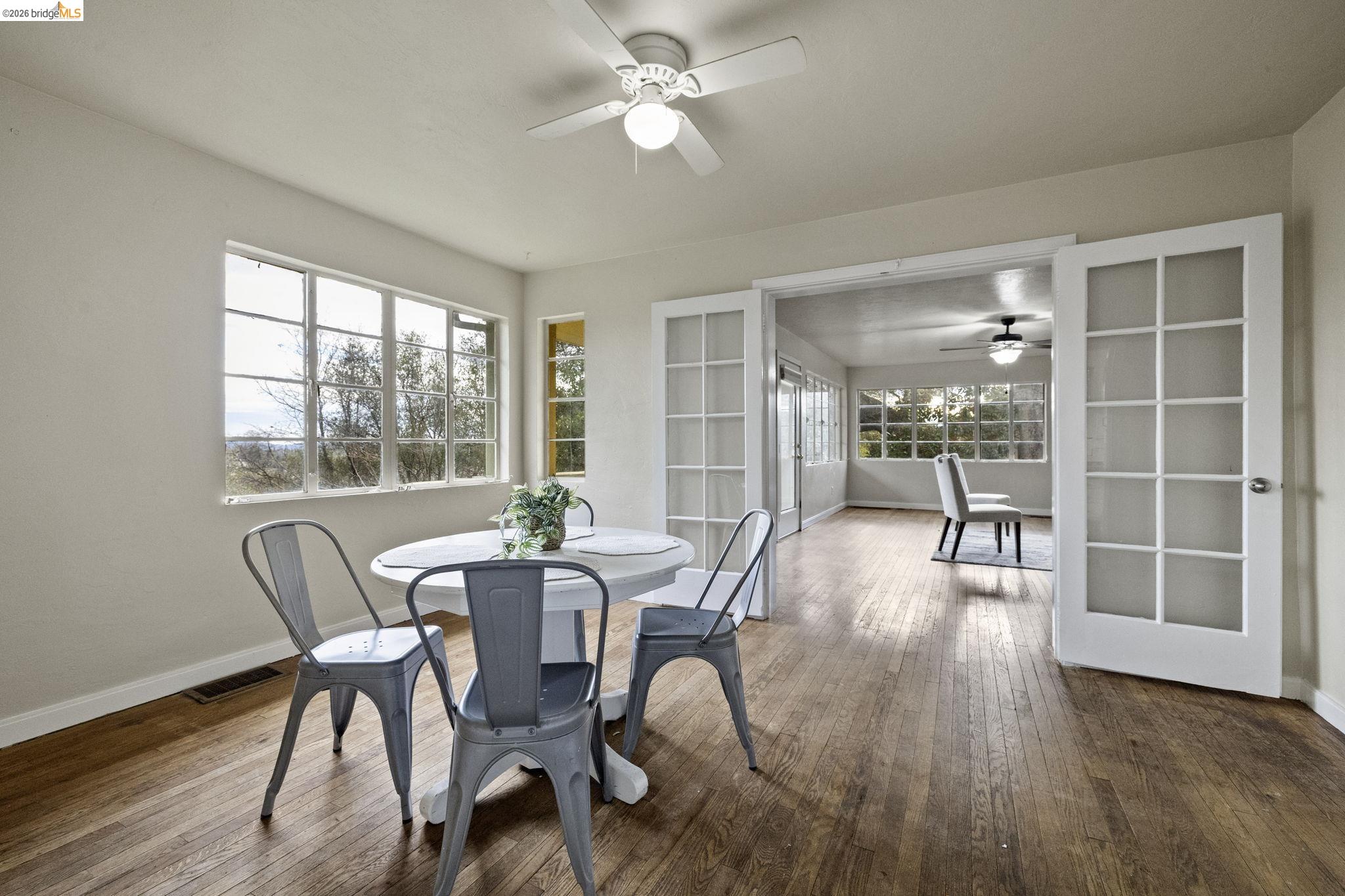 299 Summit Avenue Sonora, CA 95370 - Photo 13 of 38 Dining area featuring a ceiling fan and dark wood finished floors