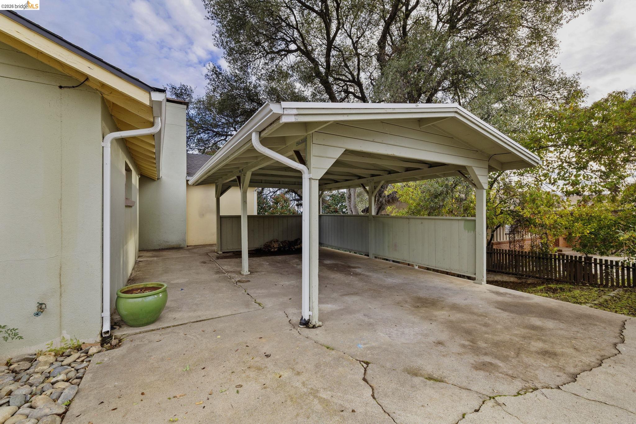 299 Summit Avenue Sonora, CA 95370 - Photo 26 of 38 View of parking featuring driveway and a detached carport