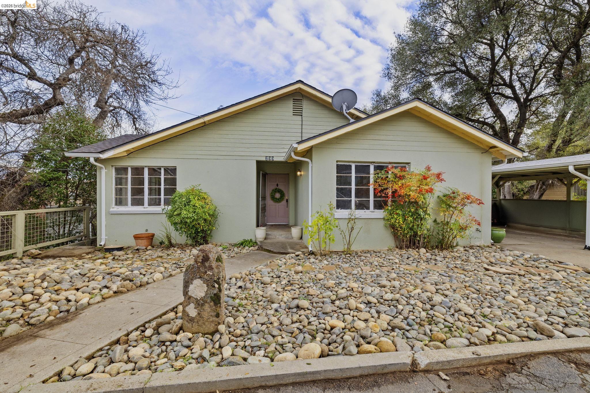 299 Summit Avenue Sonora, CA 95370 - Photo 3 of 38 View of front of house with a carport and stucco siding