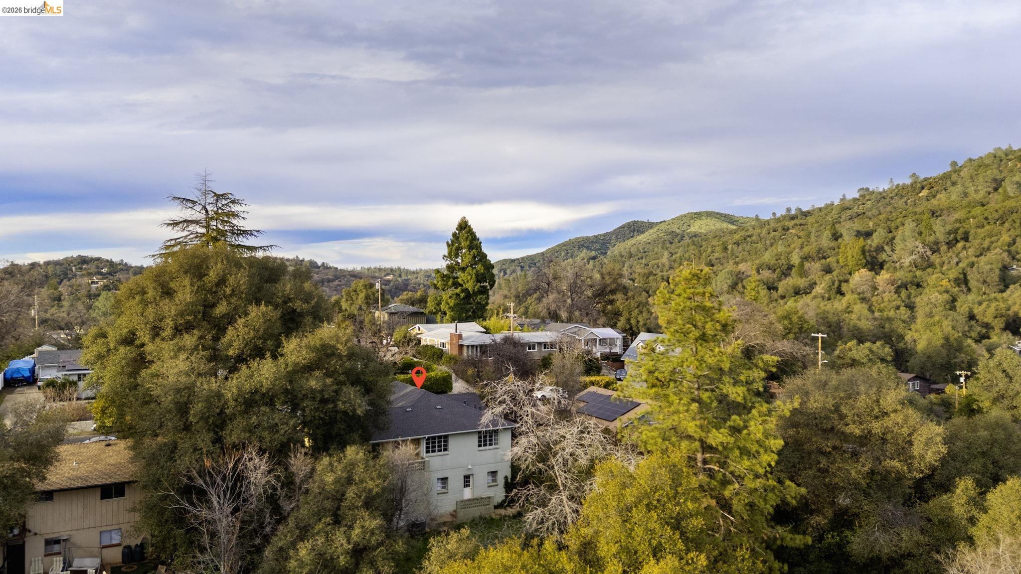 299 Summit Avenue Sonora, CA 95370 - Photo 37 of 38 Aerial view of a heavily wooded area and mountains