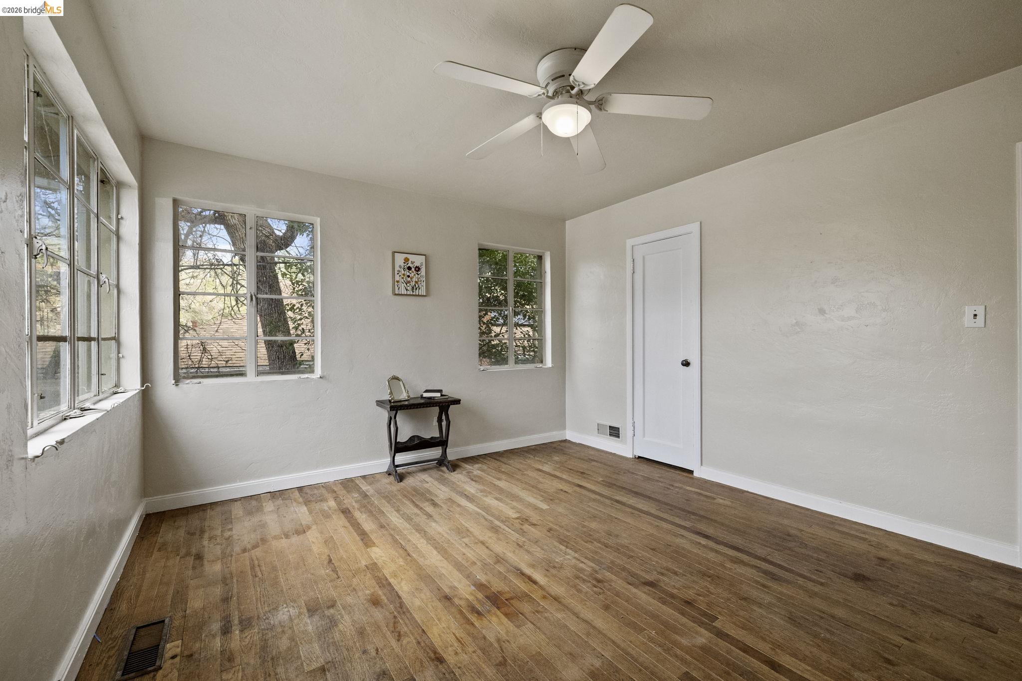299 Summit Avenue Sonora, CA 95370 - Photo 7 of 38 Spare room featuring hardwood / wood-style floors and ceiling fan