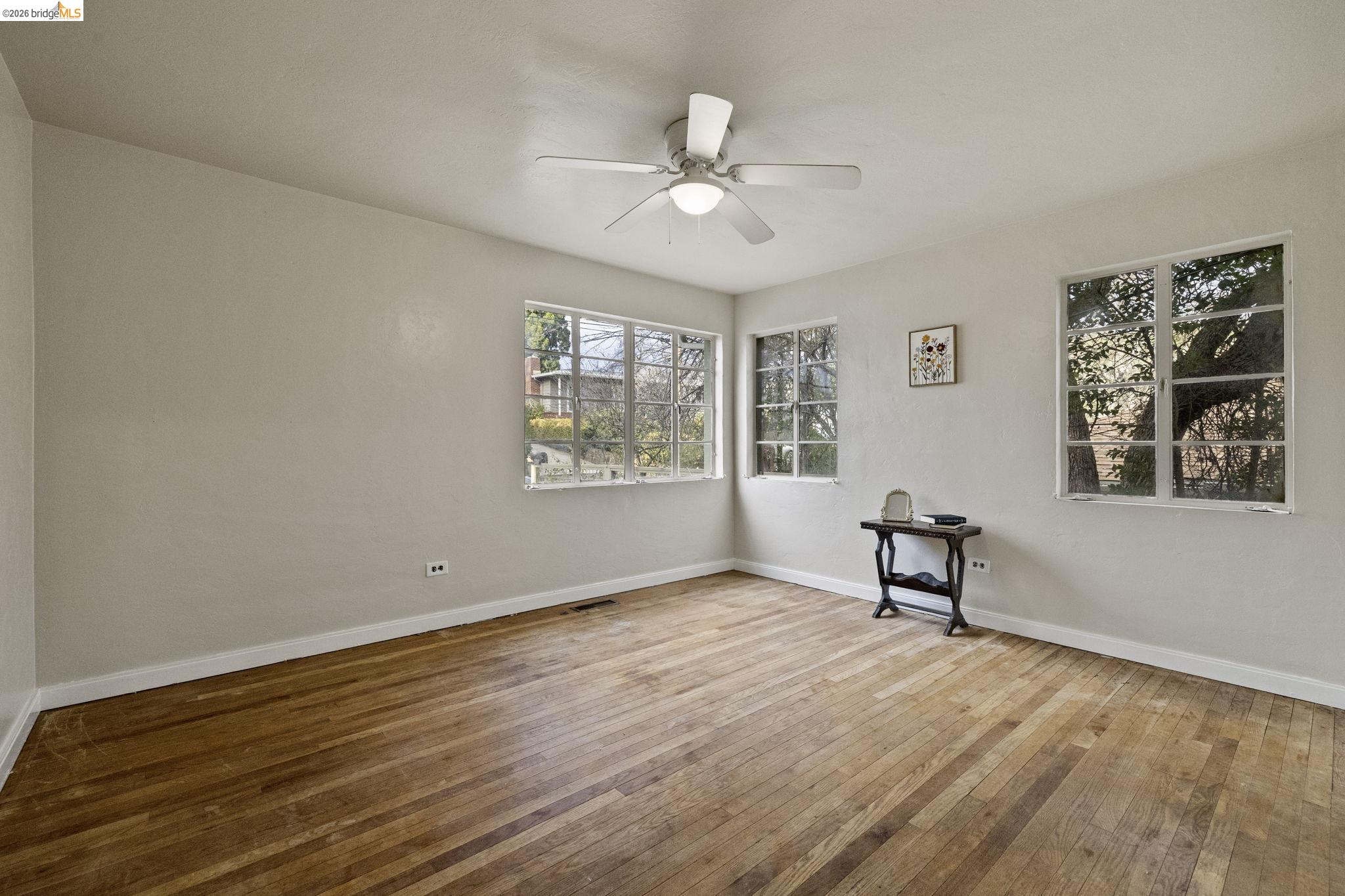 299 Summit Avenue Sonora, CA 95370 - Photo 8 of 38 Unfurnished room with hardwood / wood-style floors and a ceiling fan
