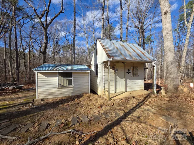 a front view of a house with parking area