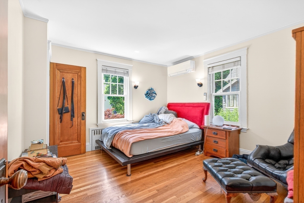 76-78 Lewis Road Belmont, MA 02478 - Photo 26 of 36 a bedroom with a bed and windows