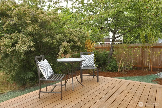 a view of a chairs and table on the wooden floor