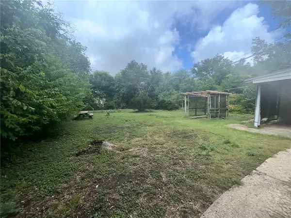 a backyard of a house with lots of green space