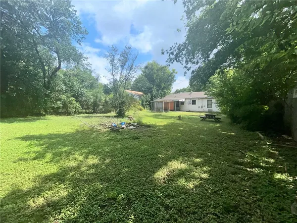 a view of a house with a big yard