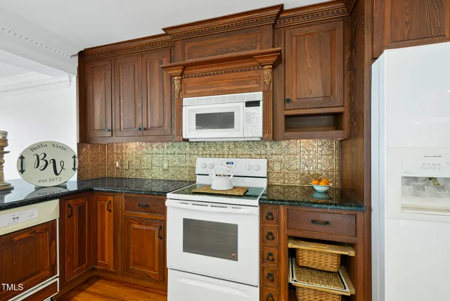 a living room with furniture and a flat screen tv with wooden floor