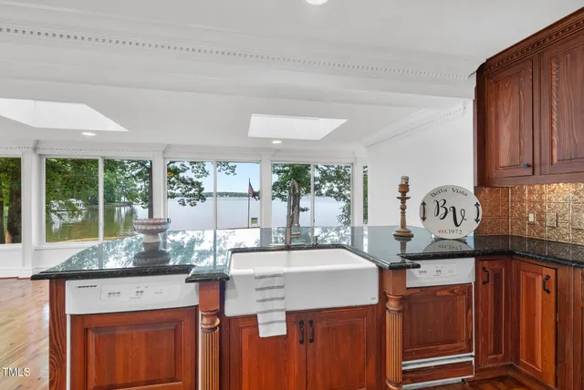 a living room with furniture a fireplace and wooden floor