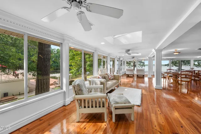a view of a patio with a table chairs and a backyard