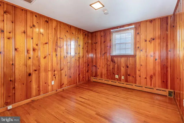 a view of a room with wooden walls