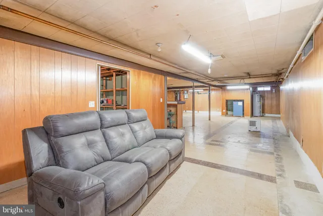 a living room with furniture and large window