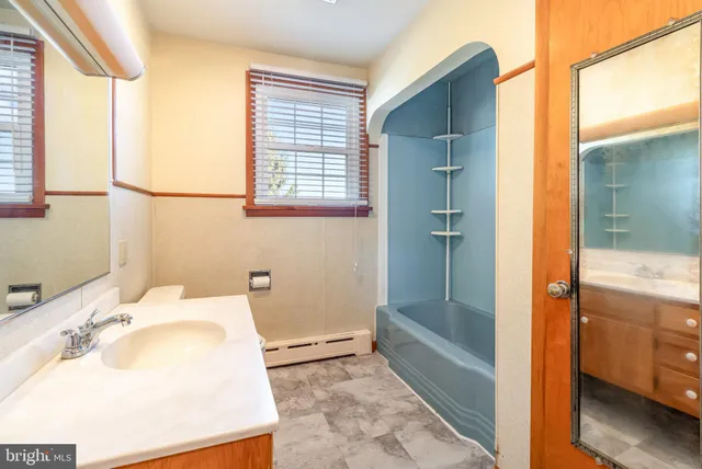 a bathroom with a sink and a bathtub