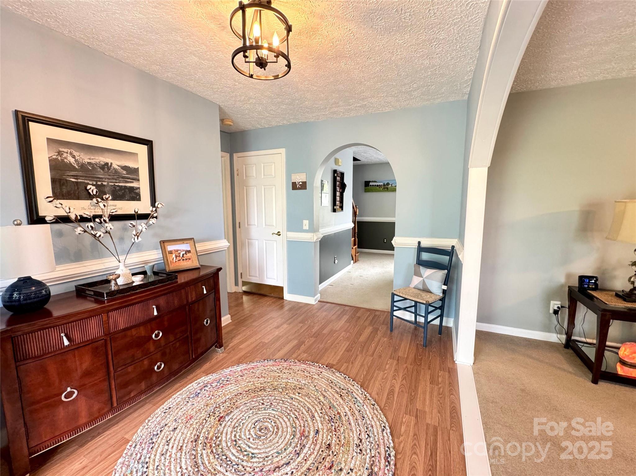 5006 Howell School Road Jonesville, NC 28642 - Photo 12 of 47 a bed room with a bed and a dresser