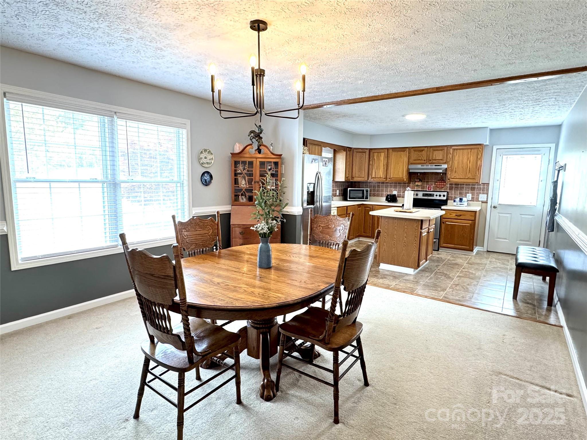 5006 Howell School Road Jonesville, NC 28642 - Photo 23 of 47 a view of a dining room with furniture window and outside view