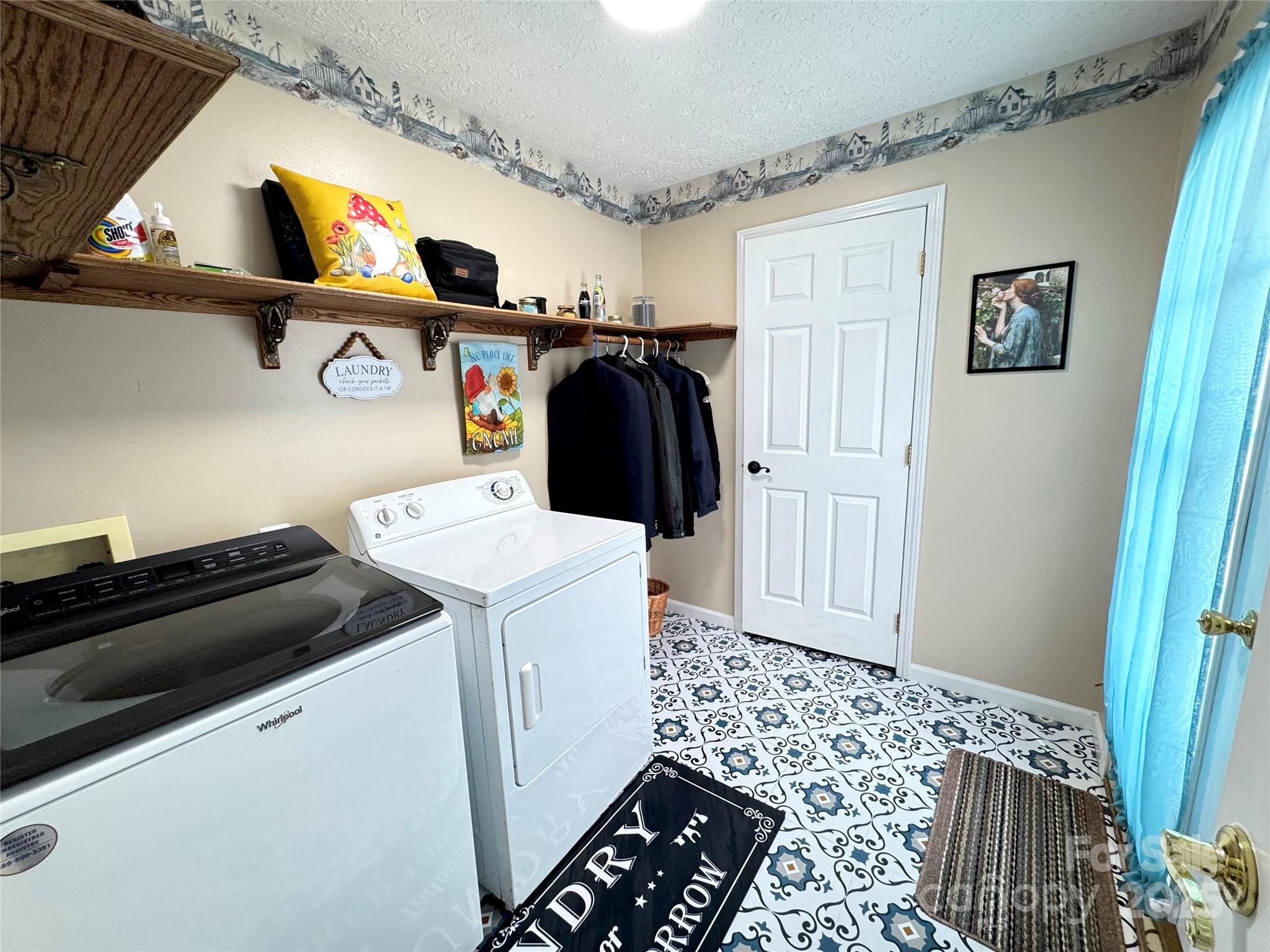 5006 Howell School Road Jonesville, NC 28642 - Photo 27 of 47 a utility room with dryer and washer