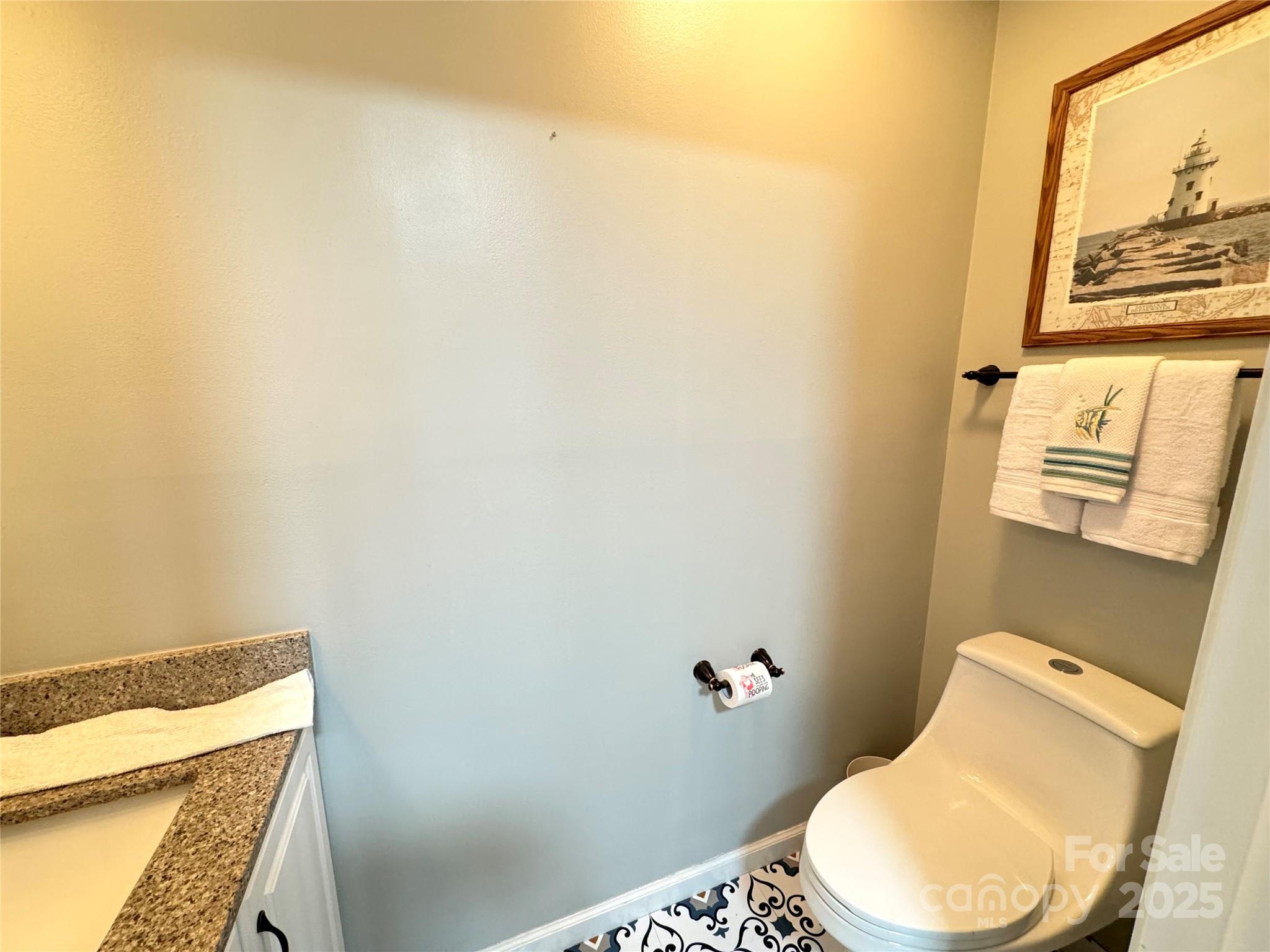 5006 Howell School Road Jonesville, NC 28642 - Photo 29 of 47 a bathroom with a toilet and a sink