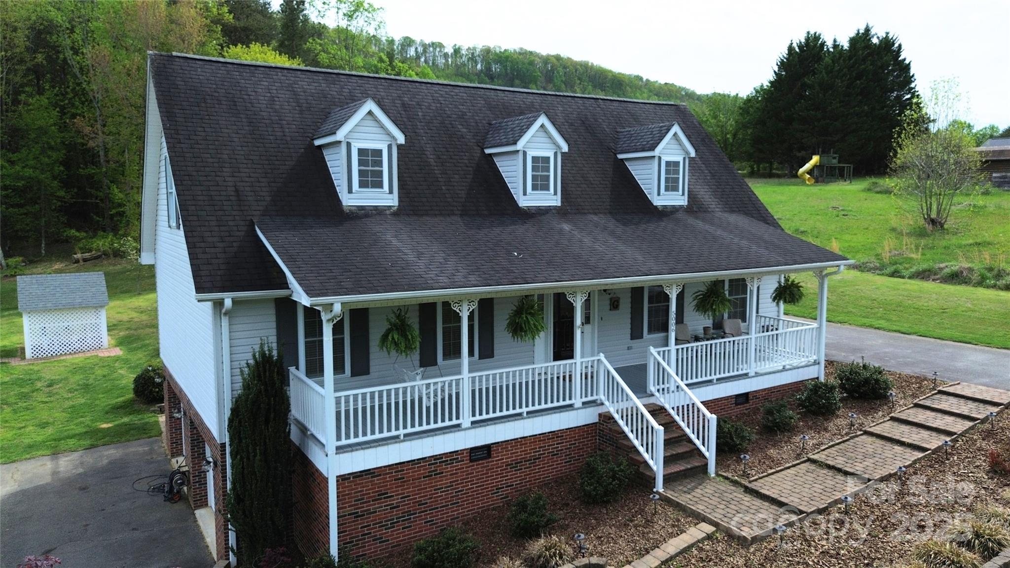 5006 Howell School Road Jonesville, NC 28642 - Photo 3 of 47 an aerial view of a house with a yard