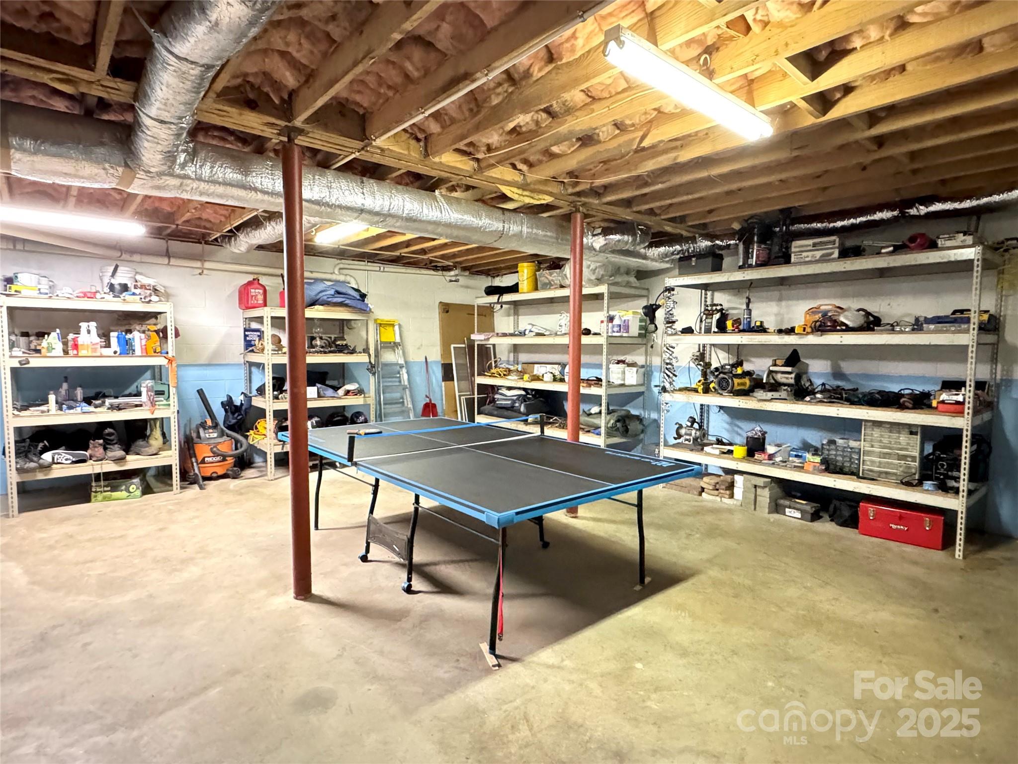 5006 Howell School Road Jonesville, NC 28642 - Photo 38 of 47 a room with lots of furniture and clutter