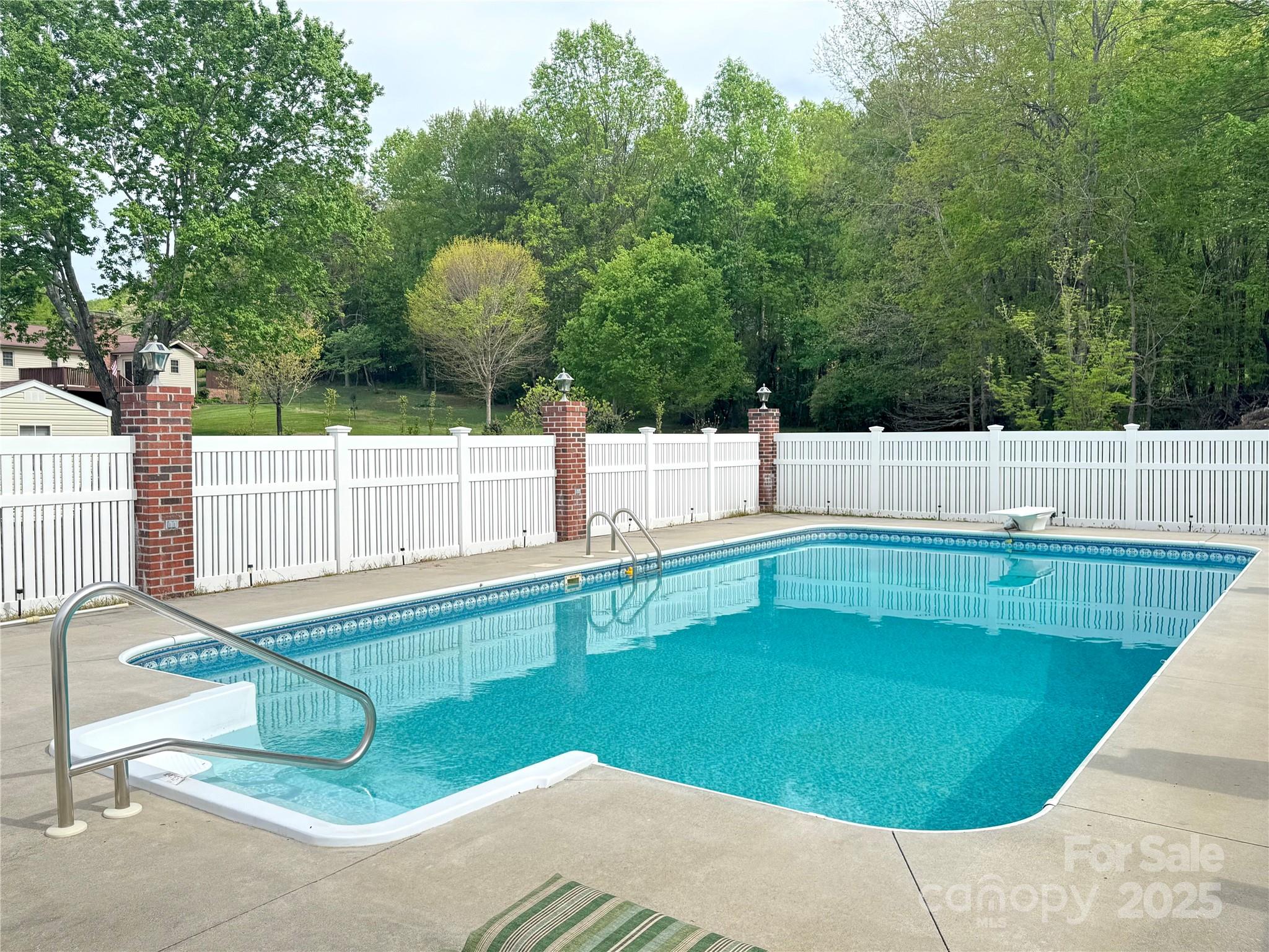 5006 Howell School Road Jonesville, NC 28642 - Photo 44 of 47 a view of a backyard and a swimming pool