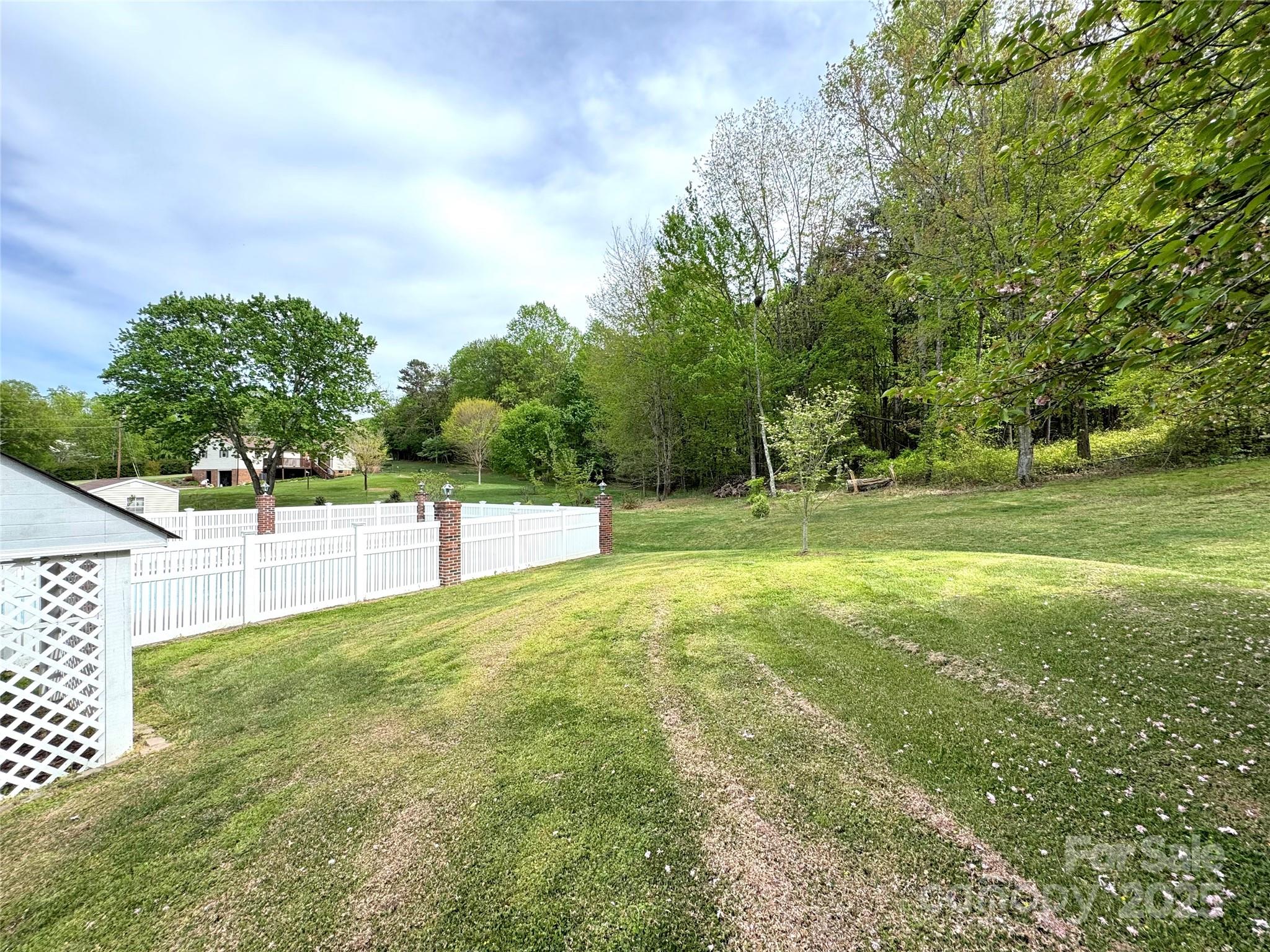 5006 Howell School Road Jonesville, NC 28642 - Photo 46 of 47 a view of a field with trees in the background