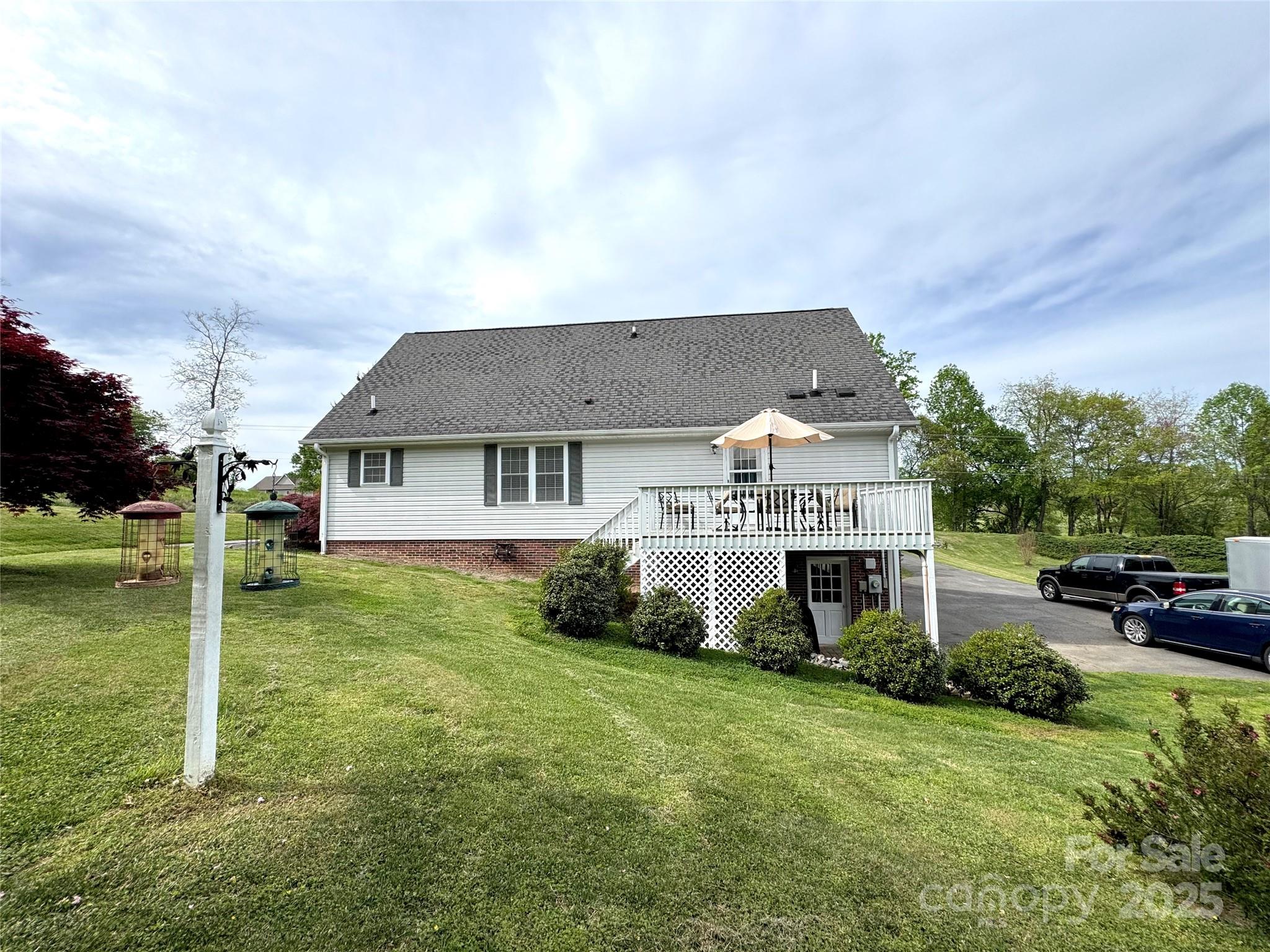 5006 Howell School Road Jonesville, NC 28642 - Photo 47 of 47 a front view of a house with garden