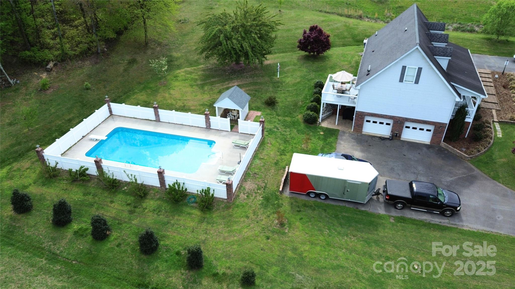 5006 Howell School Road Jonesville, NC 28642 - Photo 5 of 47 an aerial view of a house with swimming pool garden and patio