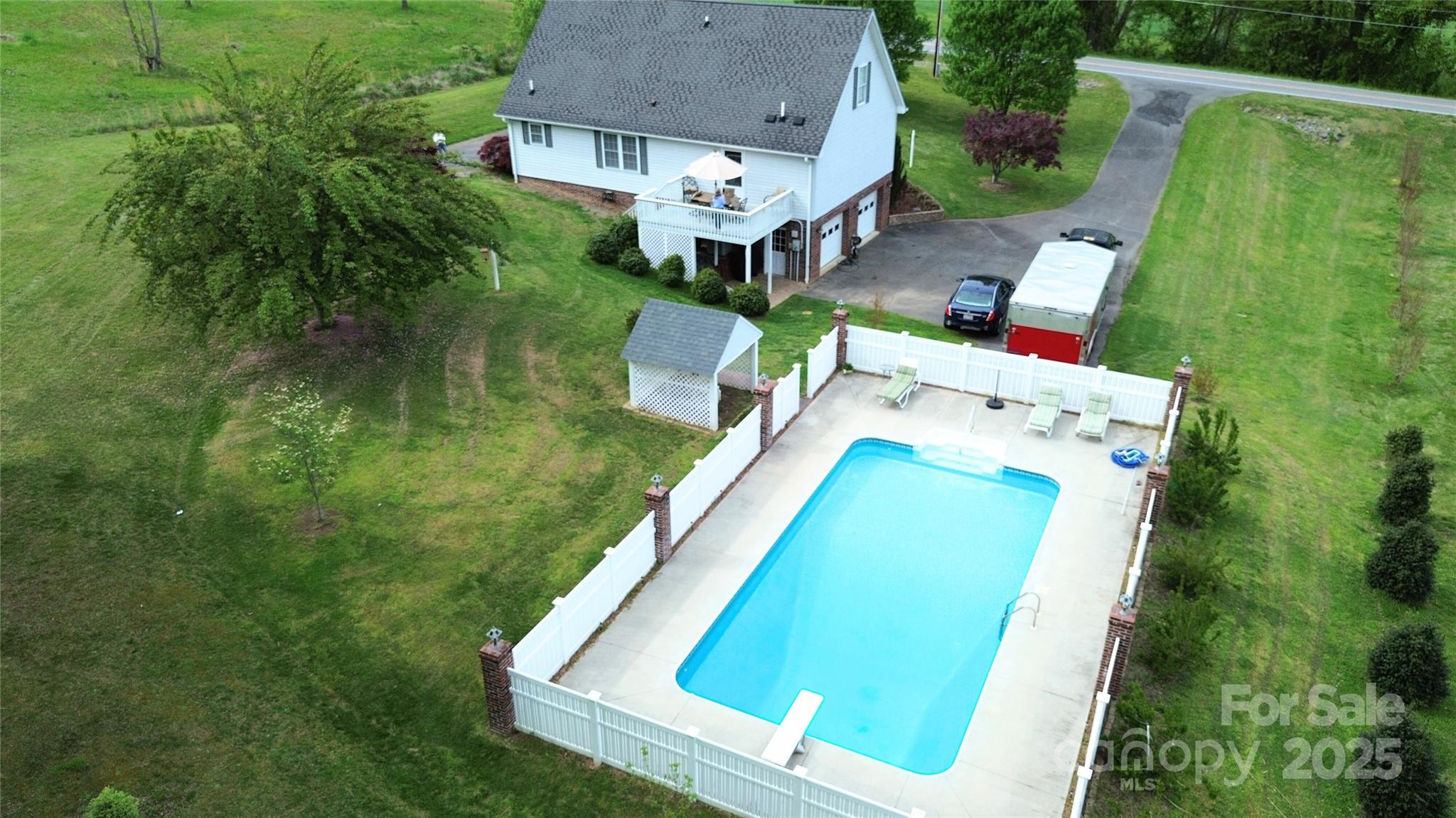5006 Howell School Road Jonesville, NC 28642 - Photo 6 of 47 an aerial view of a house with swimming pool and outdoor space