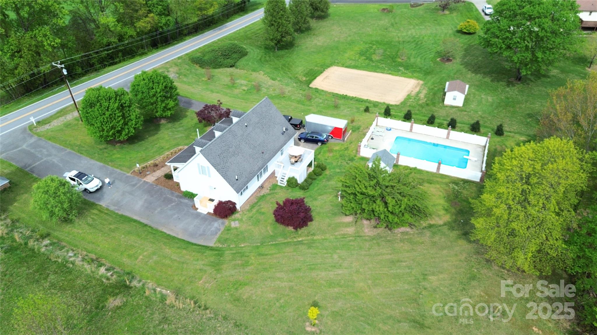 5006 Howell School Road Jonesville, NC 28642 - Photo 7 of 47 an aerial view of residential house with outdoor space and trees all around