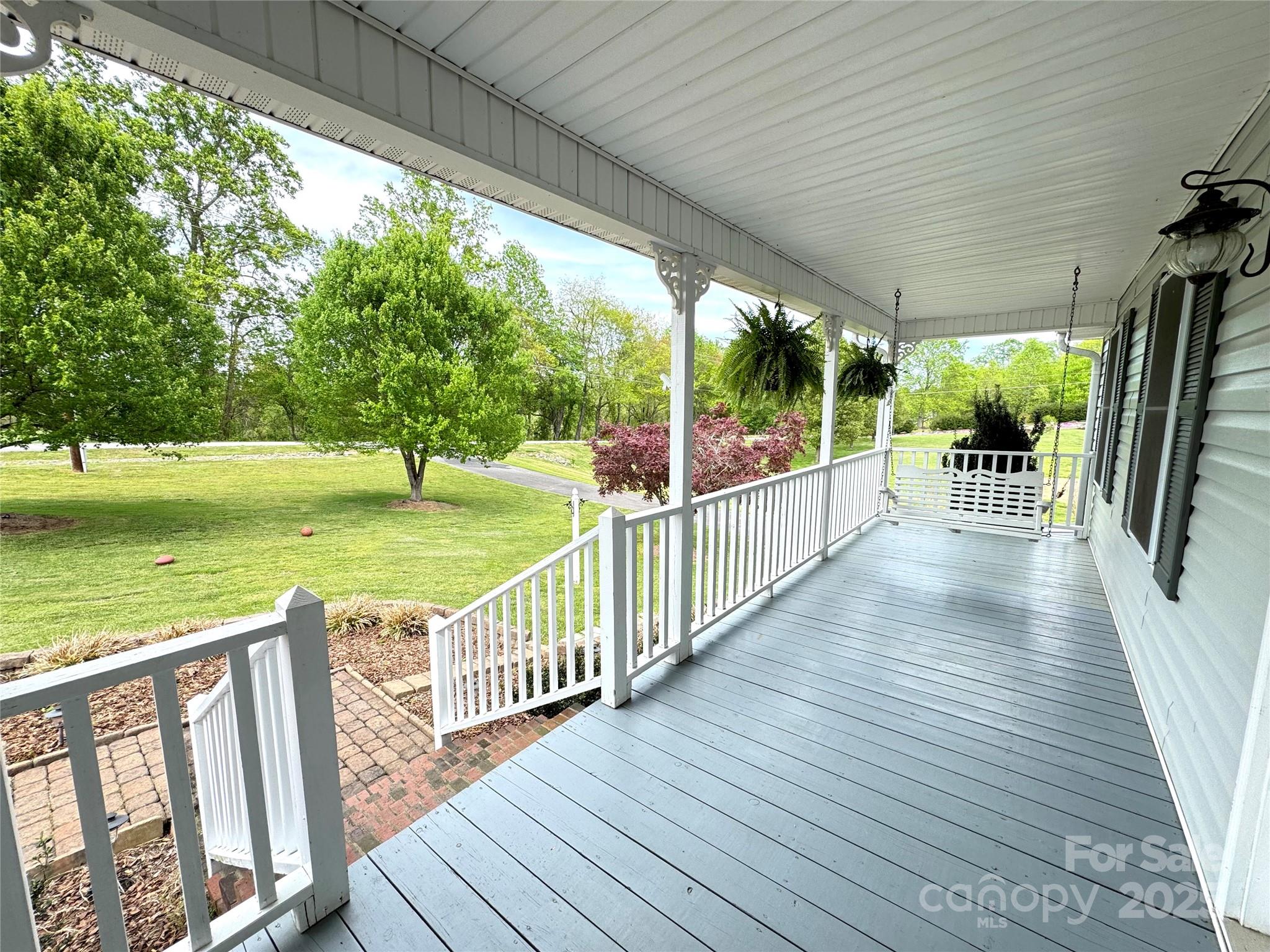 5006 Howell School Road Jonesville, NC 28642 - Photo 10 of 47 a view of a deck with wooden floor and outdoor space