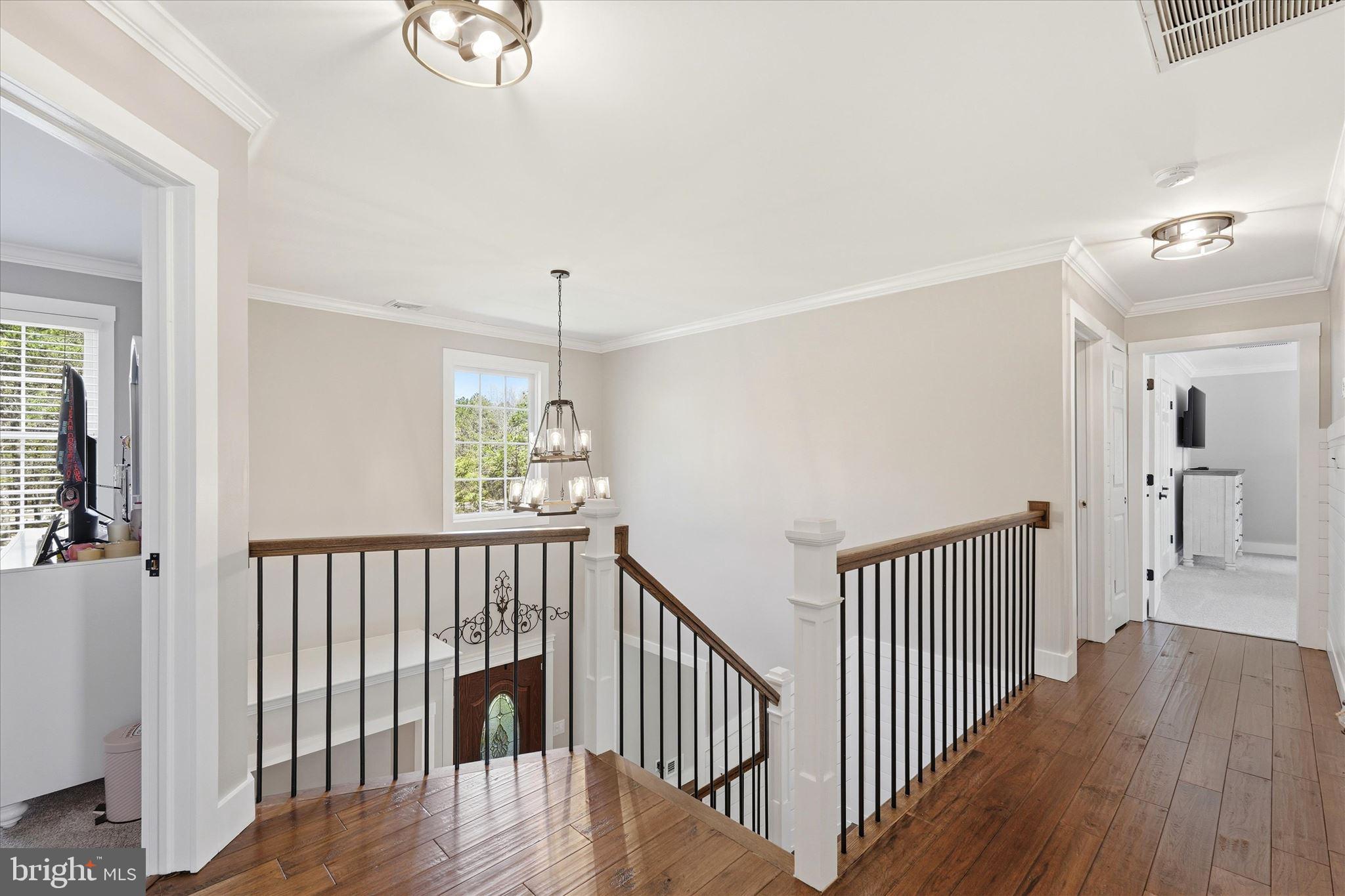 176 Warren Grove Road Barnegat, NJ 08005 - Photo 33 of 71 a view of a hallway with wooden floor and windows