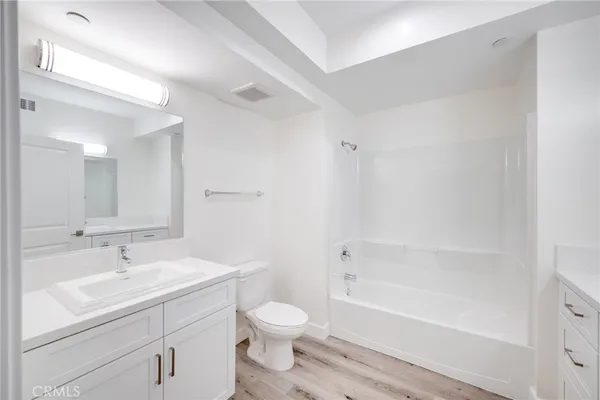 a bathroom with a sink toilet and bathtub