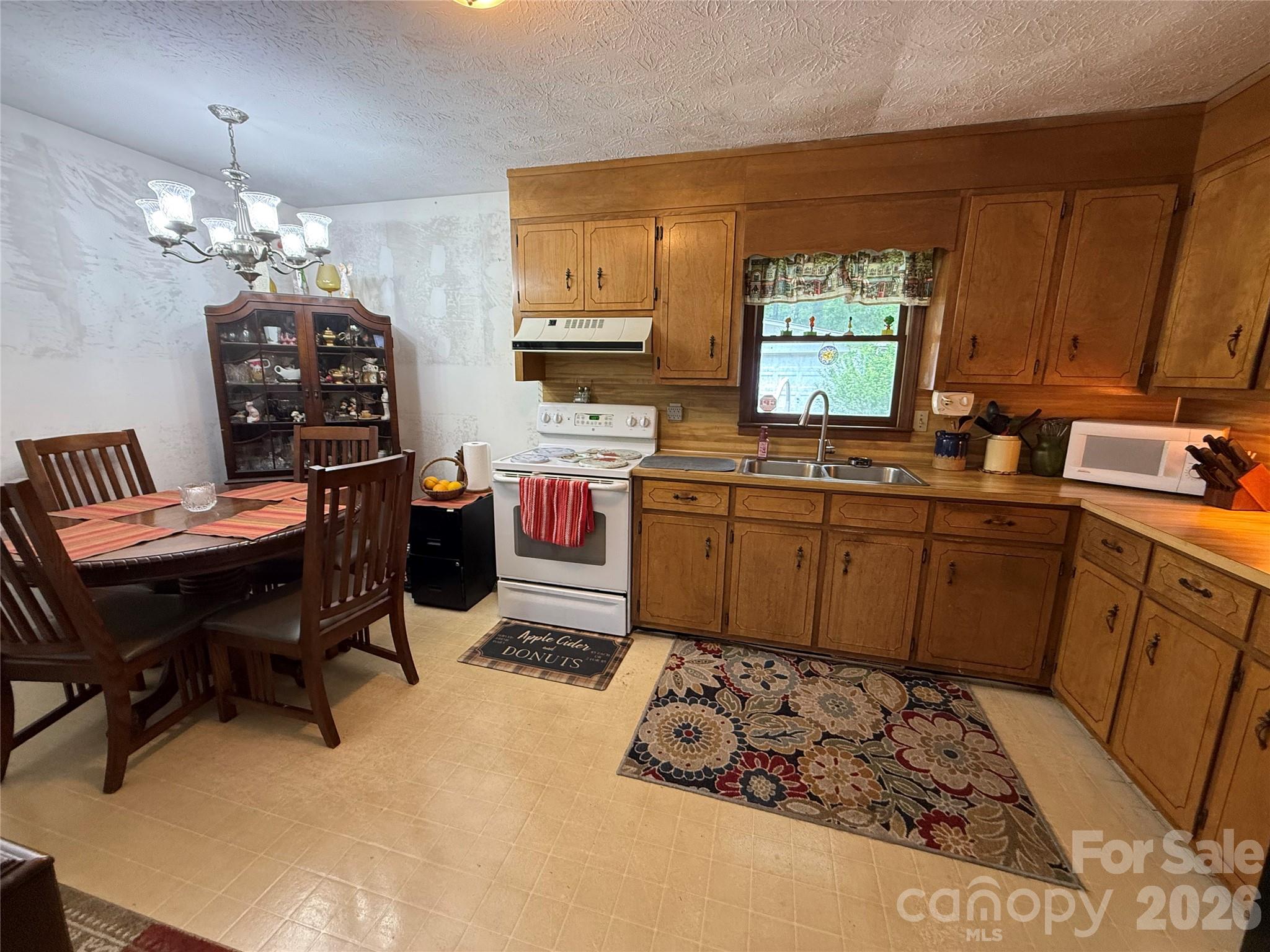 580 Legion Road Lenoir, NC 28645 - Photo 8 of 22 a kitchen with a sink and cabinets