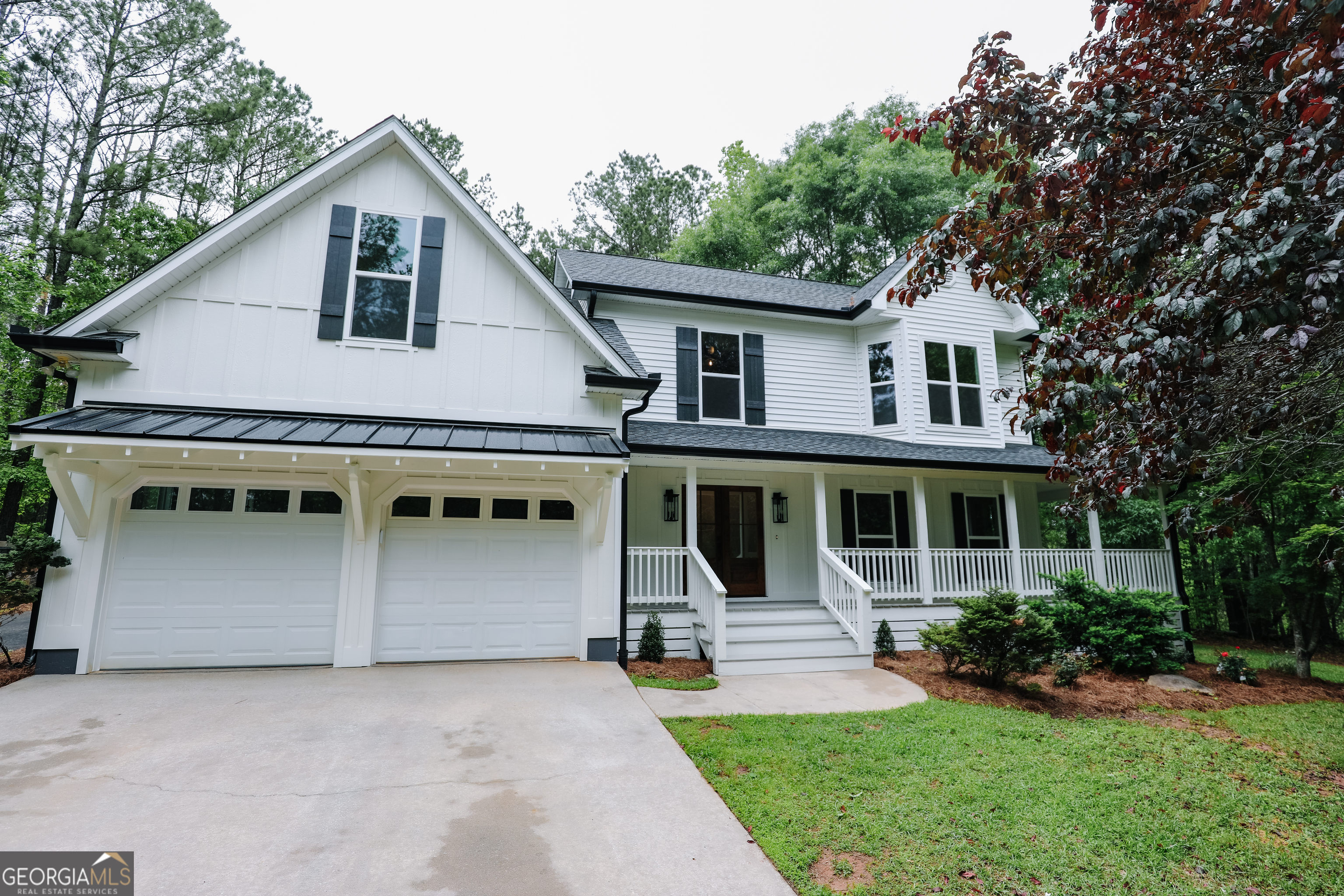 430 Pierce Chapel Road Newnan, GA 30263 - Photo 1 of 1 a front view of a house with a yard and potted plants