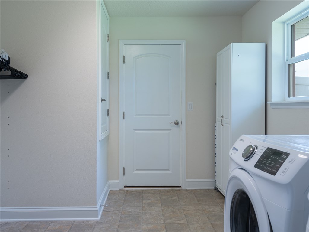 88007 Maybourne Road Yulee, FL 32097 - Photo 29 of 35 a view of livingroom with washer and dryer