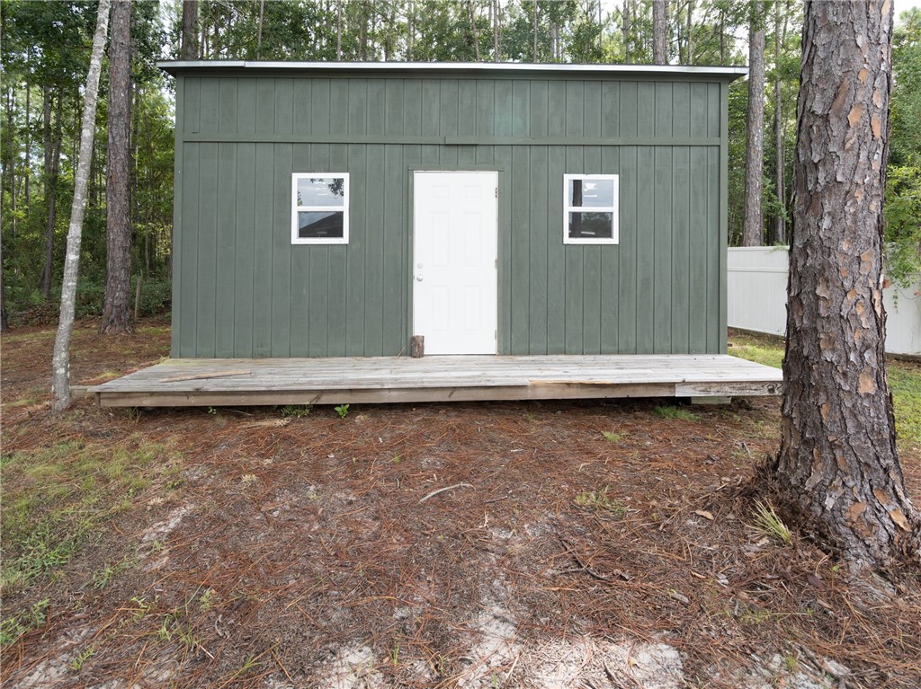 88007 Maybourne Road Yulee, FL 32097 - Photo 34 of 35 a front view of a house with a yard