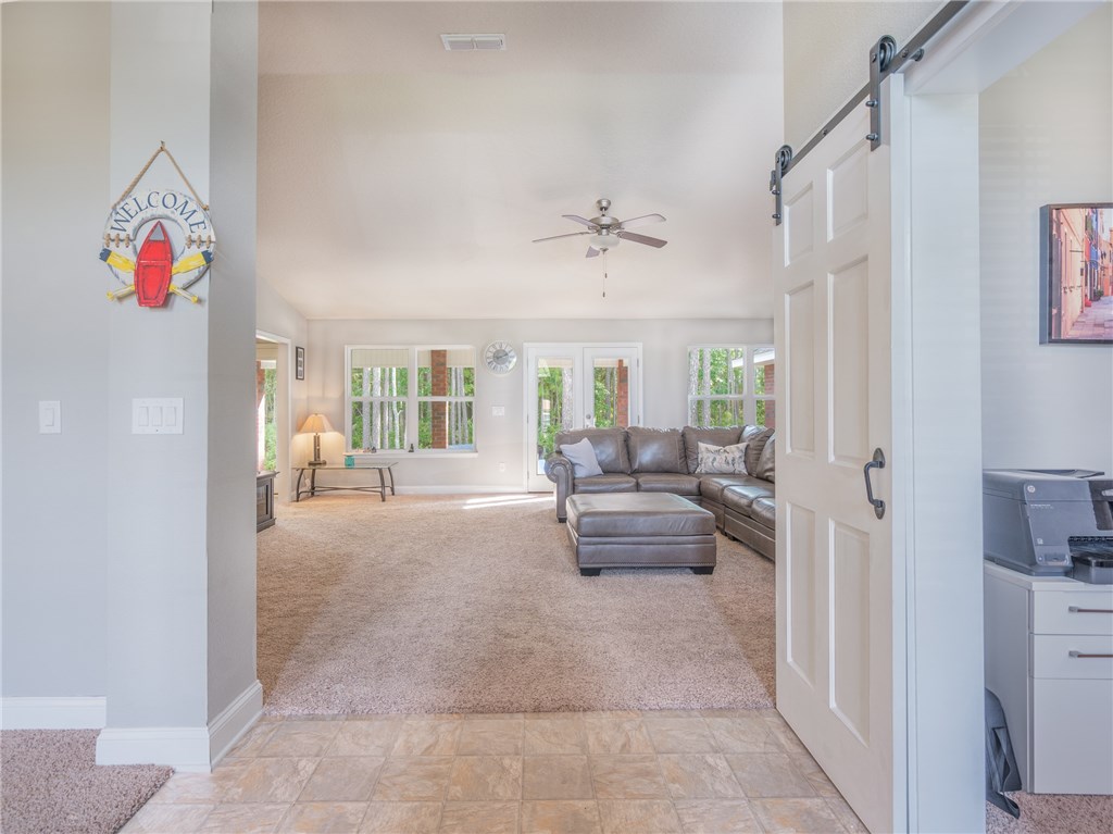 88007 Maybourne Road Yulee, FL 32097 - Photo 5 of 35 a living room with furniture and a table