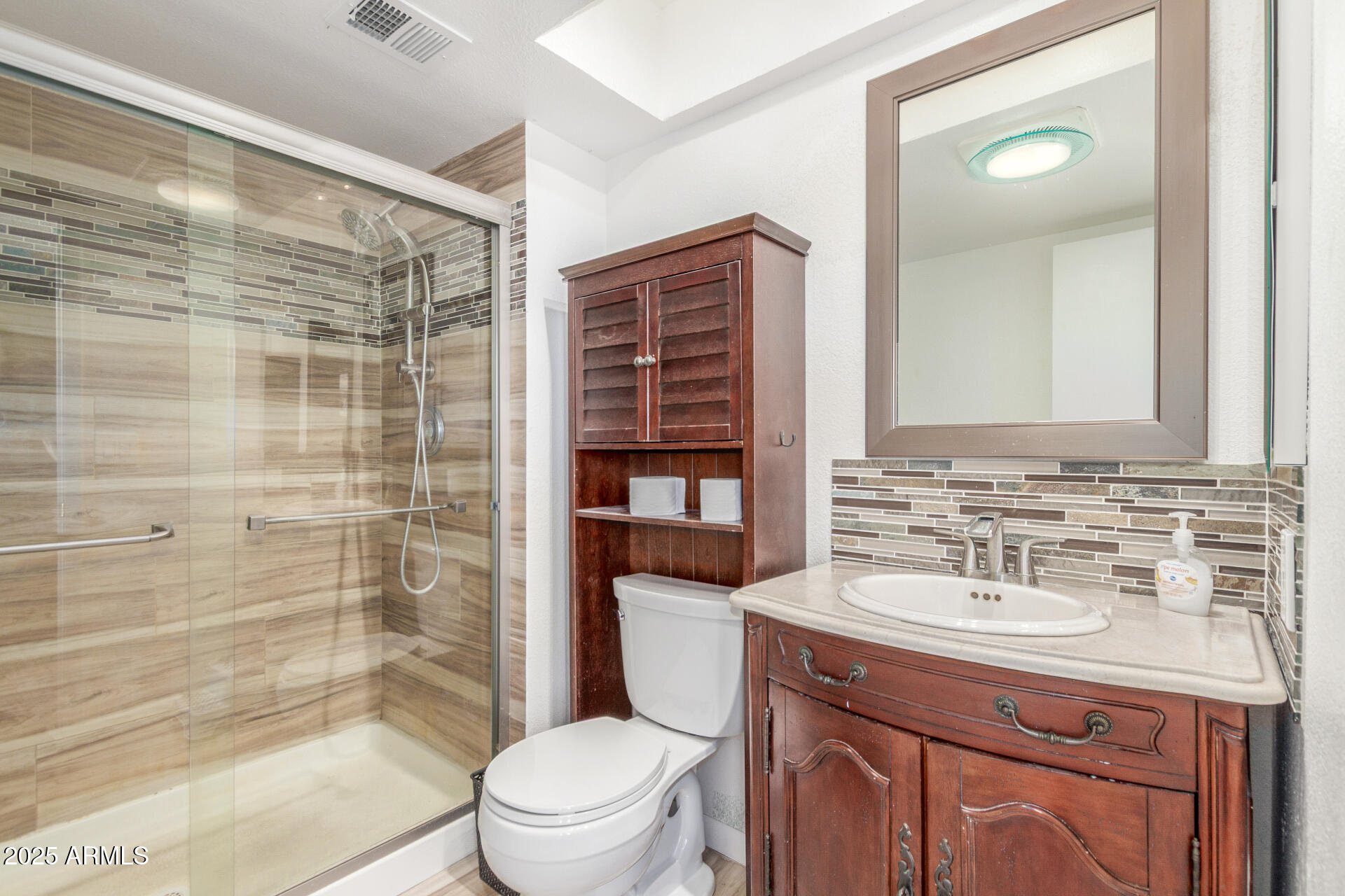 4732 West Davis Road Glendale, AZ 85306 - Photo 17 of 38 a bathroom with a sink a toilet and shower