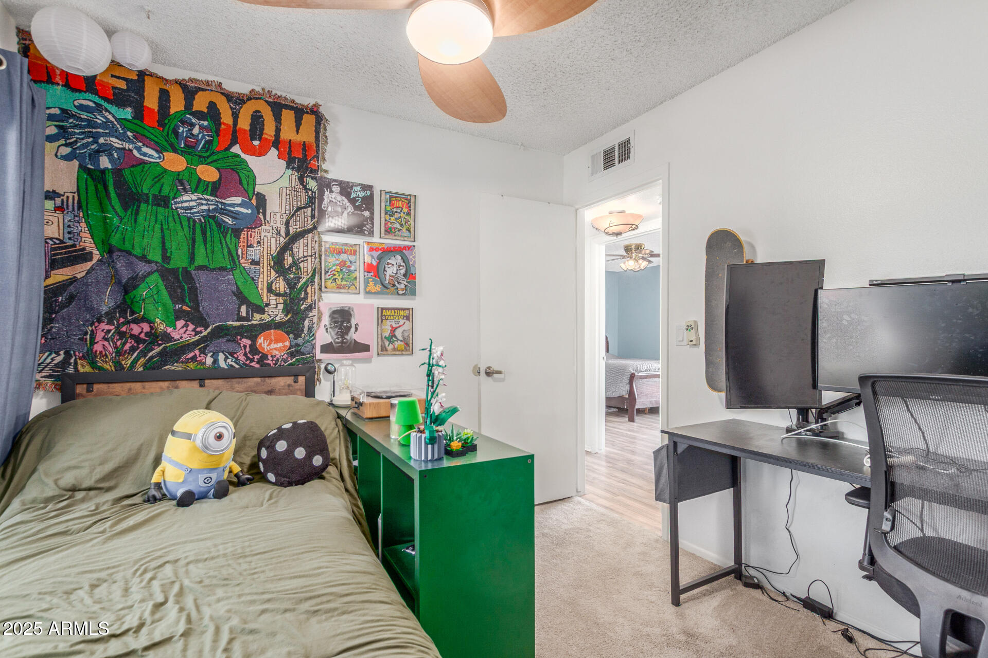 4732 West Davis Road Glendale, AZ 85306 - Photo 19 of 38 a bed room with a bed window and a table