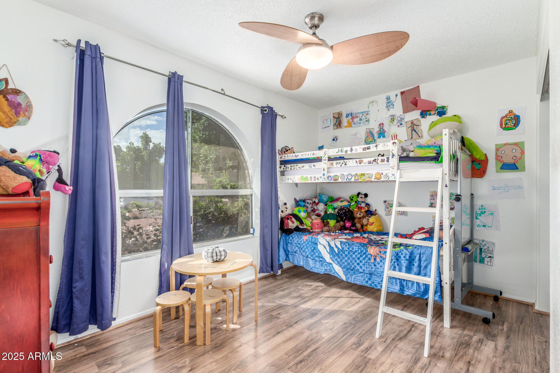4732 West Davis Road Glendale, AZ 85306 - Photo 20 of 38 a living room filled with furniture and a window