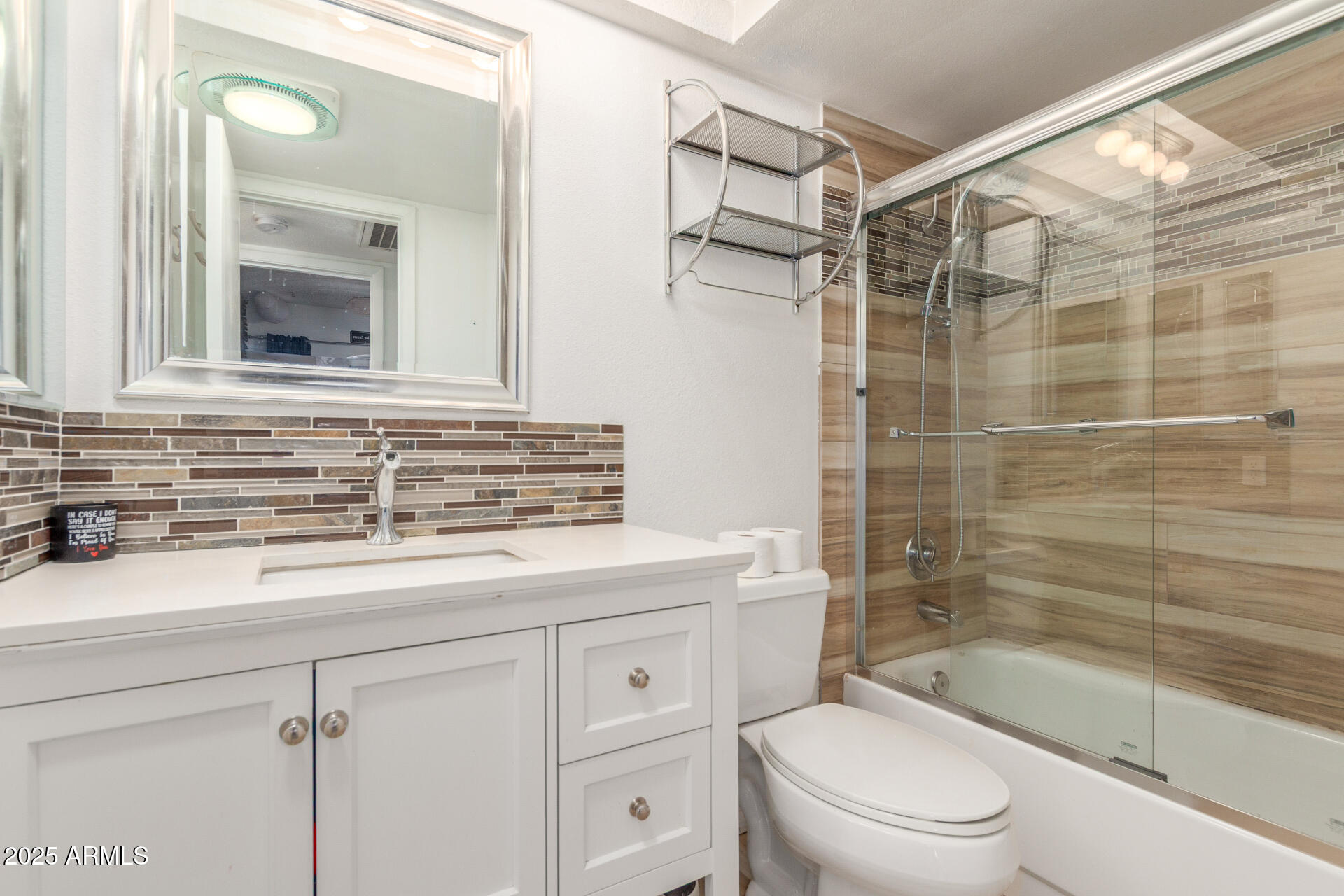 4732 West Davis Road Glendale, AZ 85306 - Photo 22 of 38 a bathroom with a sink a toilet and shower