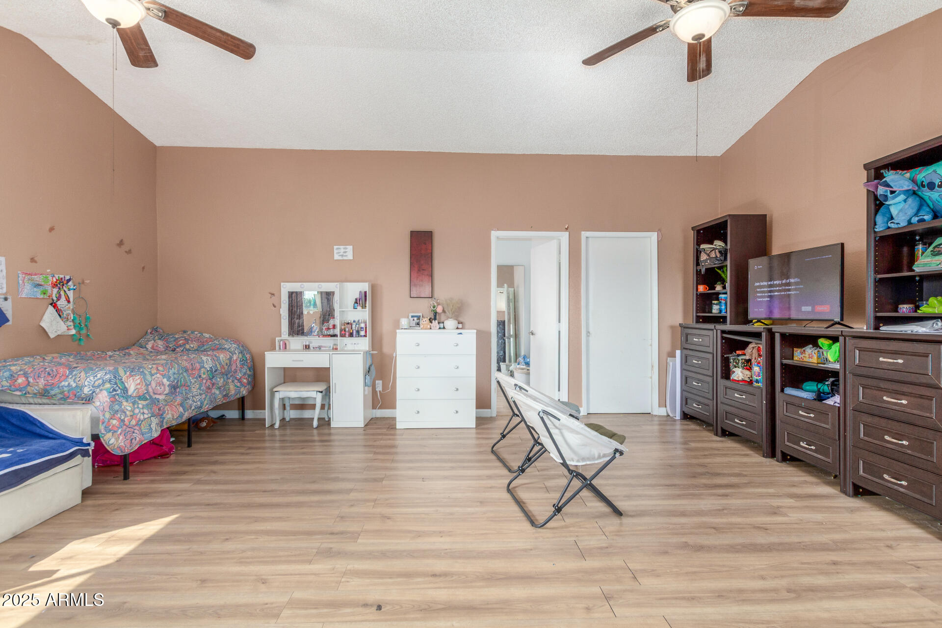 4732 West Davis Road Glendale, AZ 85306 - Photo 25 of 38 a living room with furniture and a wooden floor