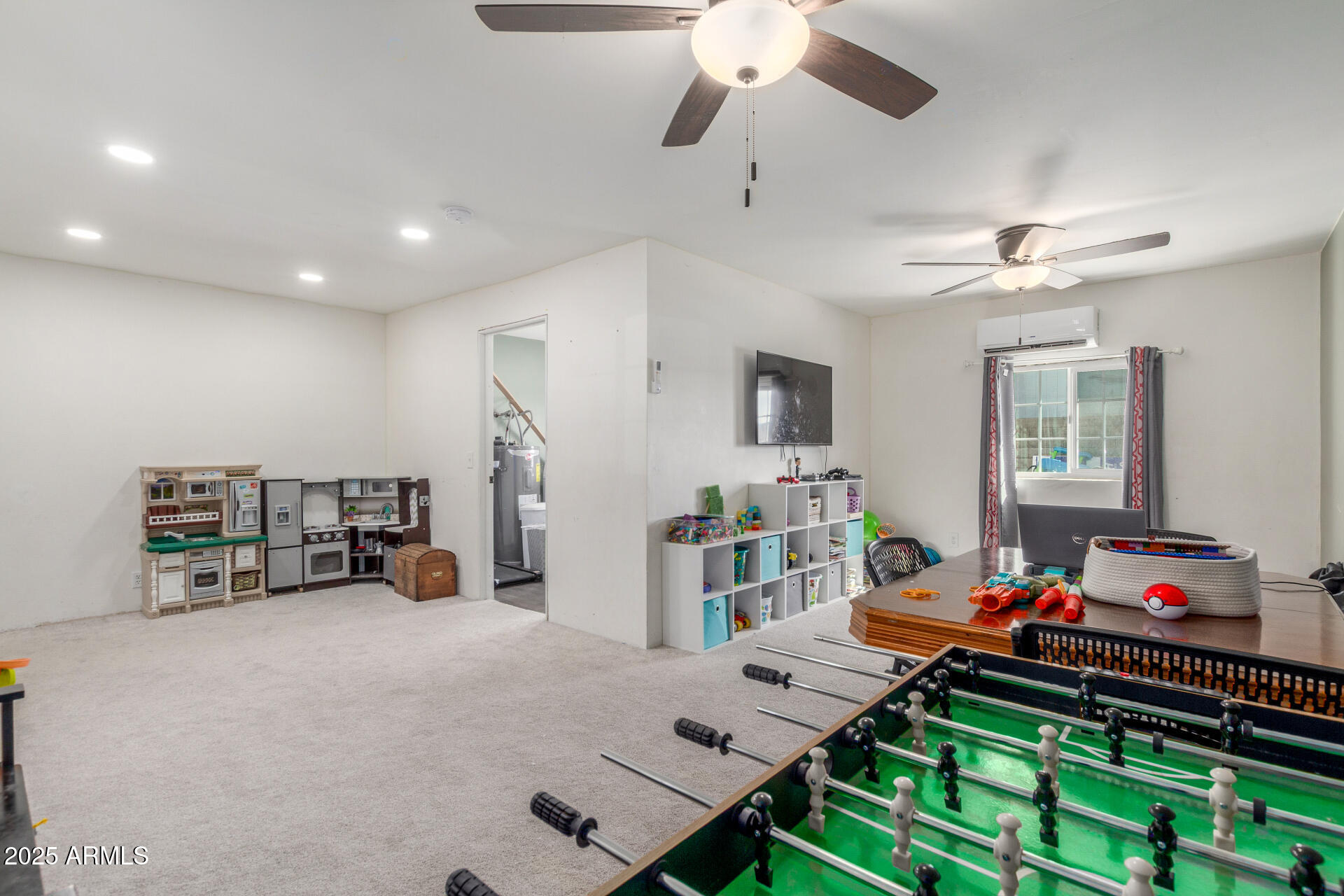 4732 West Davis Road Glendale, AZ 85306 - Photo 30 of 38 a bedroom with furniture and a chandelier