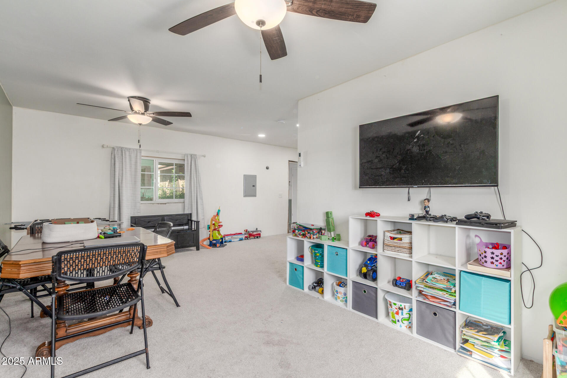 4732 West Davis Road Glendale, AZ 85306 - Photo 31 of 38 a living room with furniture and a flat screen tv