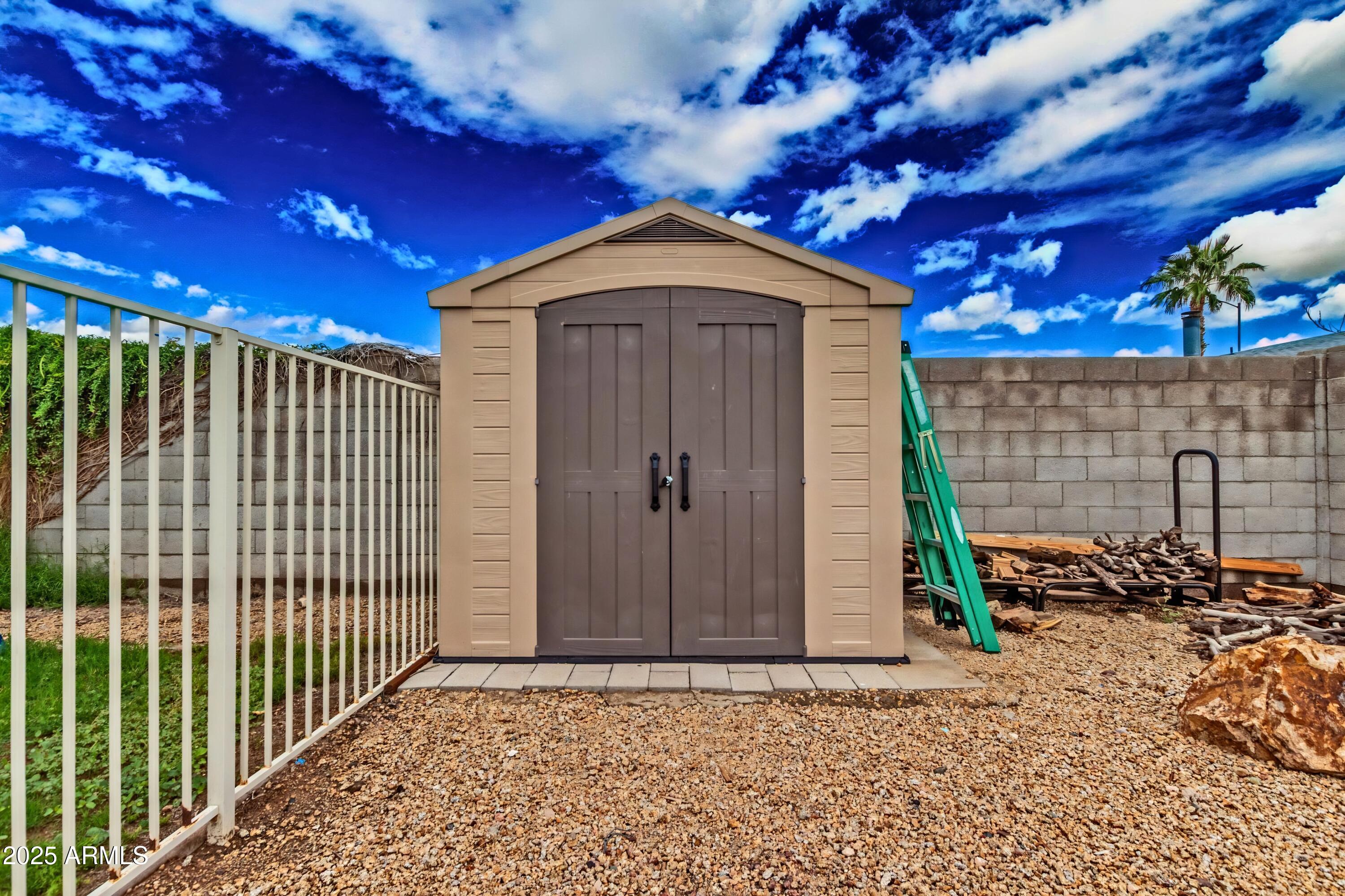 4732 West Davis Road Glendale, AZ 85306 - Photo 38 of 38 a view of a house with a small yard