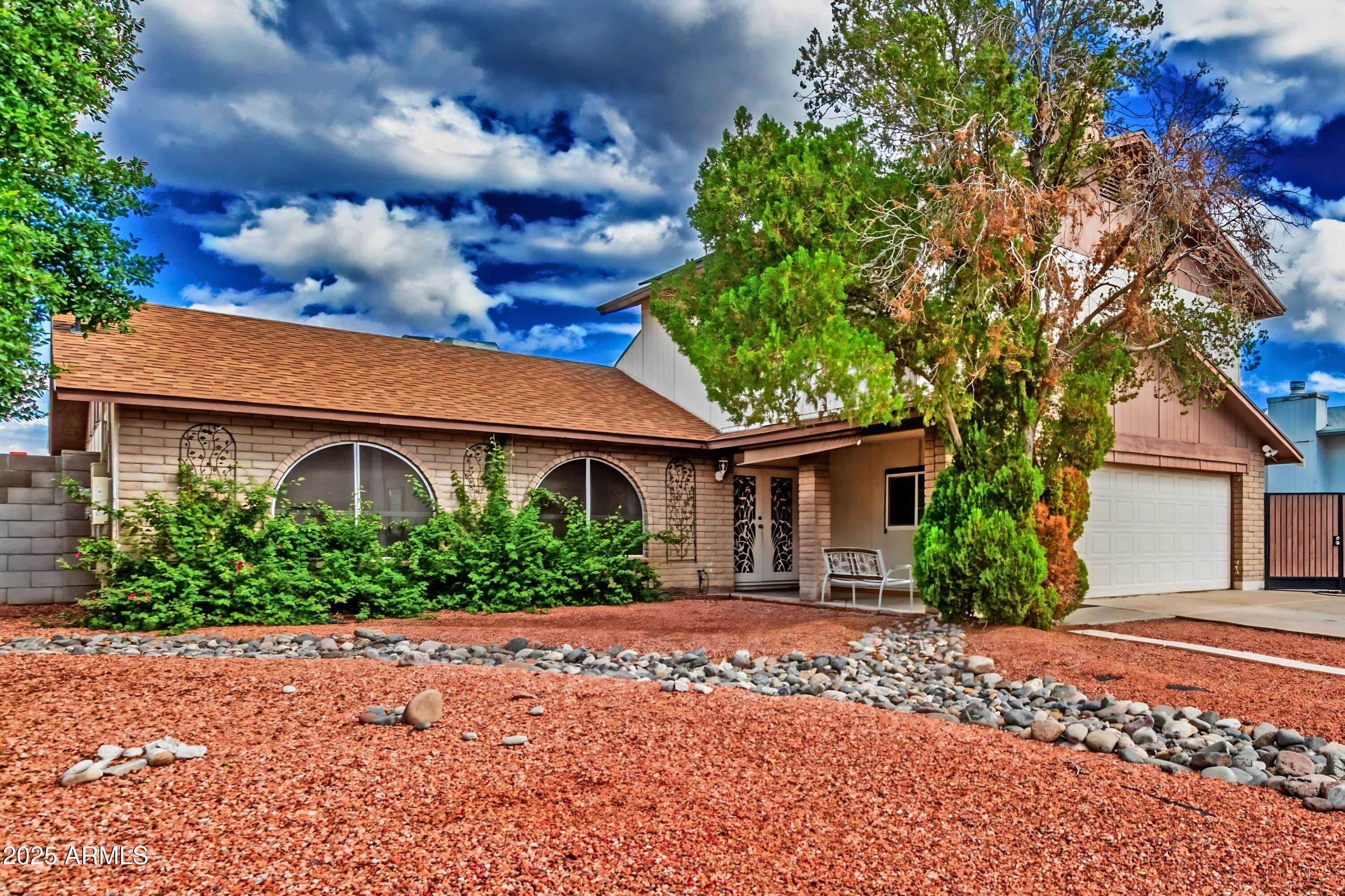 4732 West Davis Road Glendale, AZ 85306 - Photo 4 of 38 front view of house with a yard