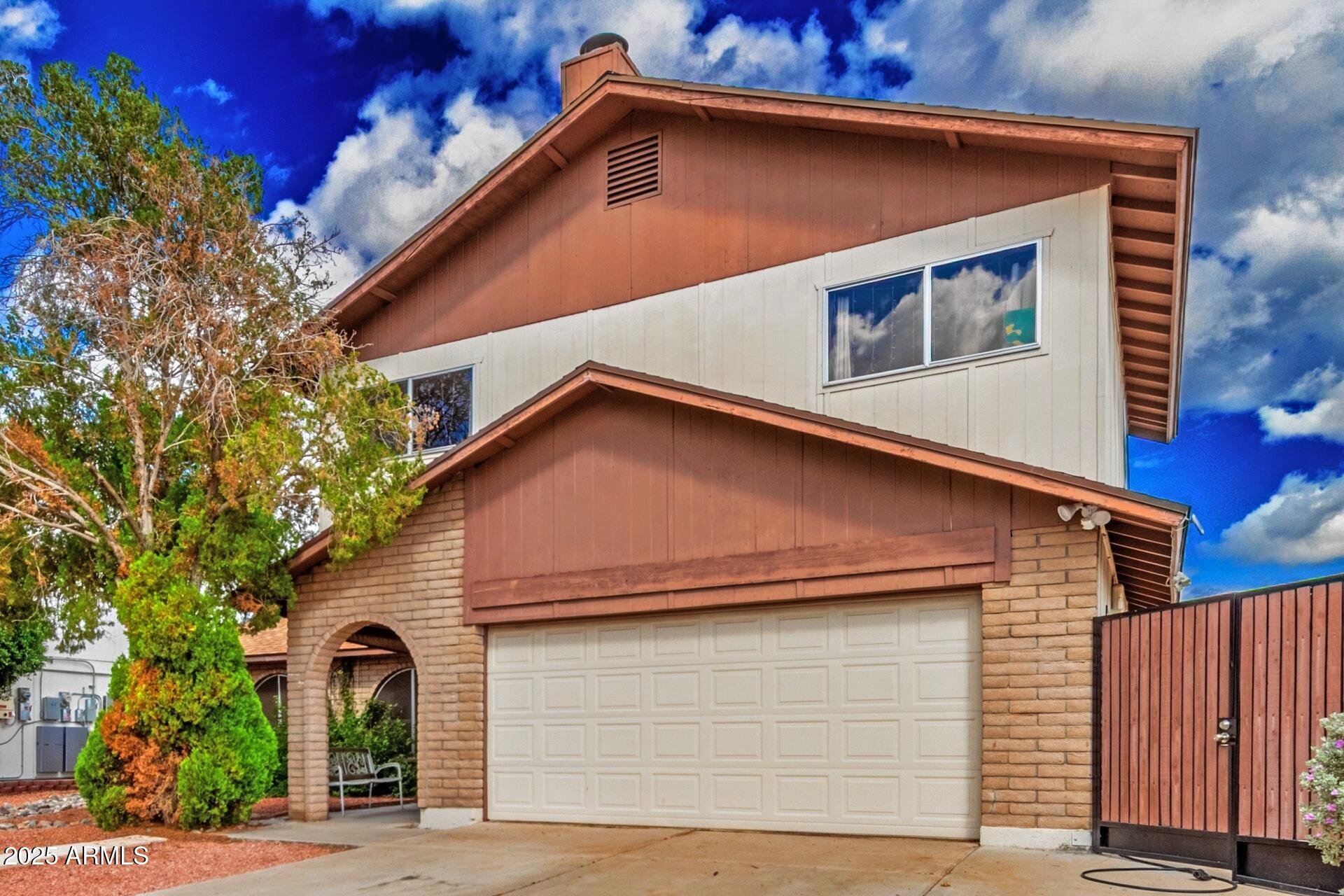 4732 West Davis Road Glendale, AZ 85306 - Photo 6 of 38 a front view of a house with garden