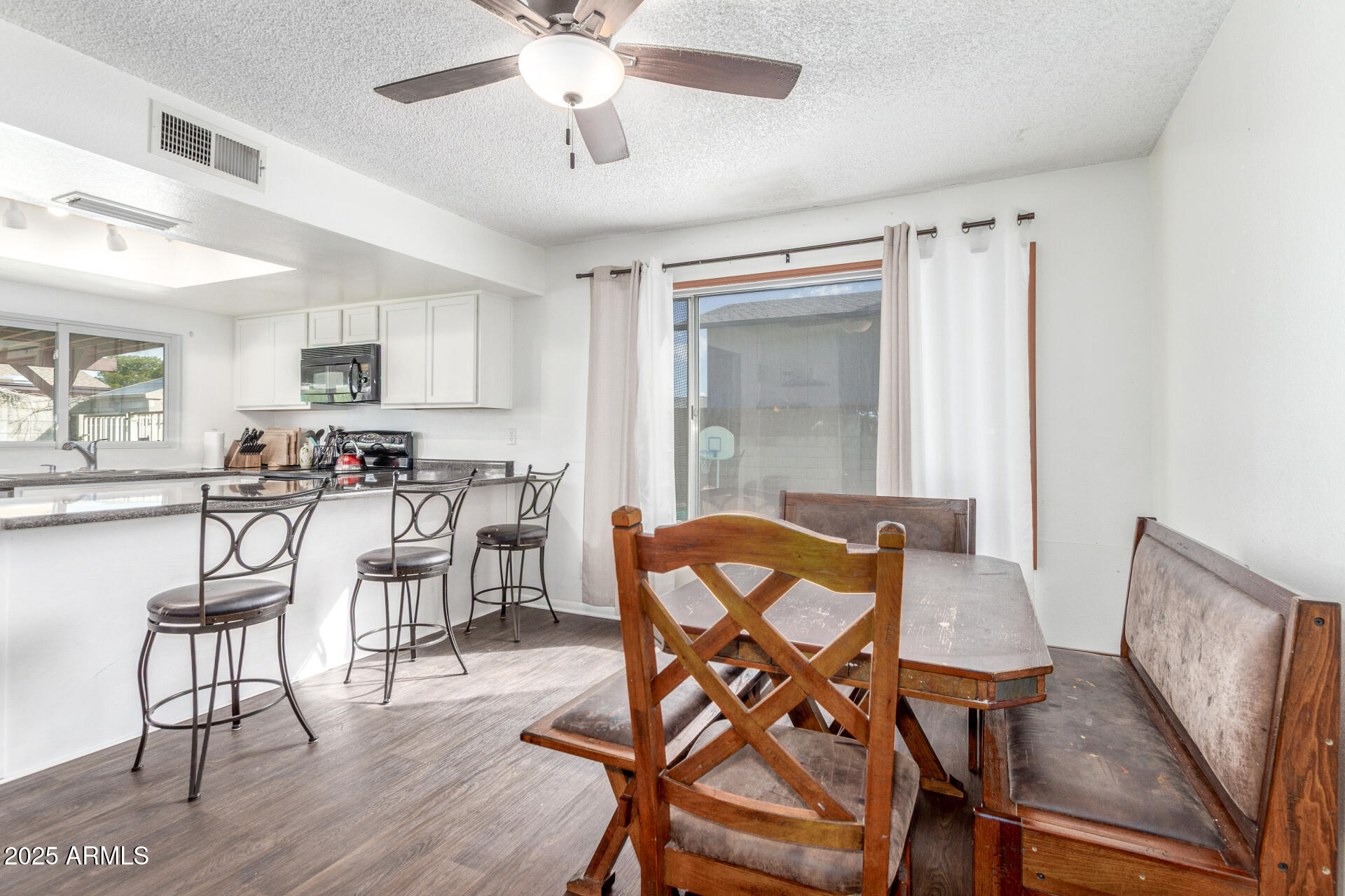 4732 West Davis Road Glendale, AZ 85306 - Photo 10 of 38 a dining room with furniture and window