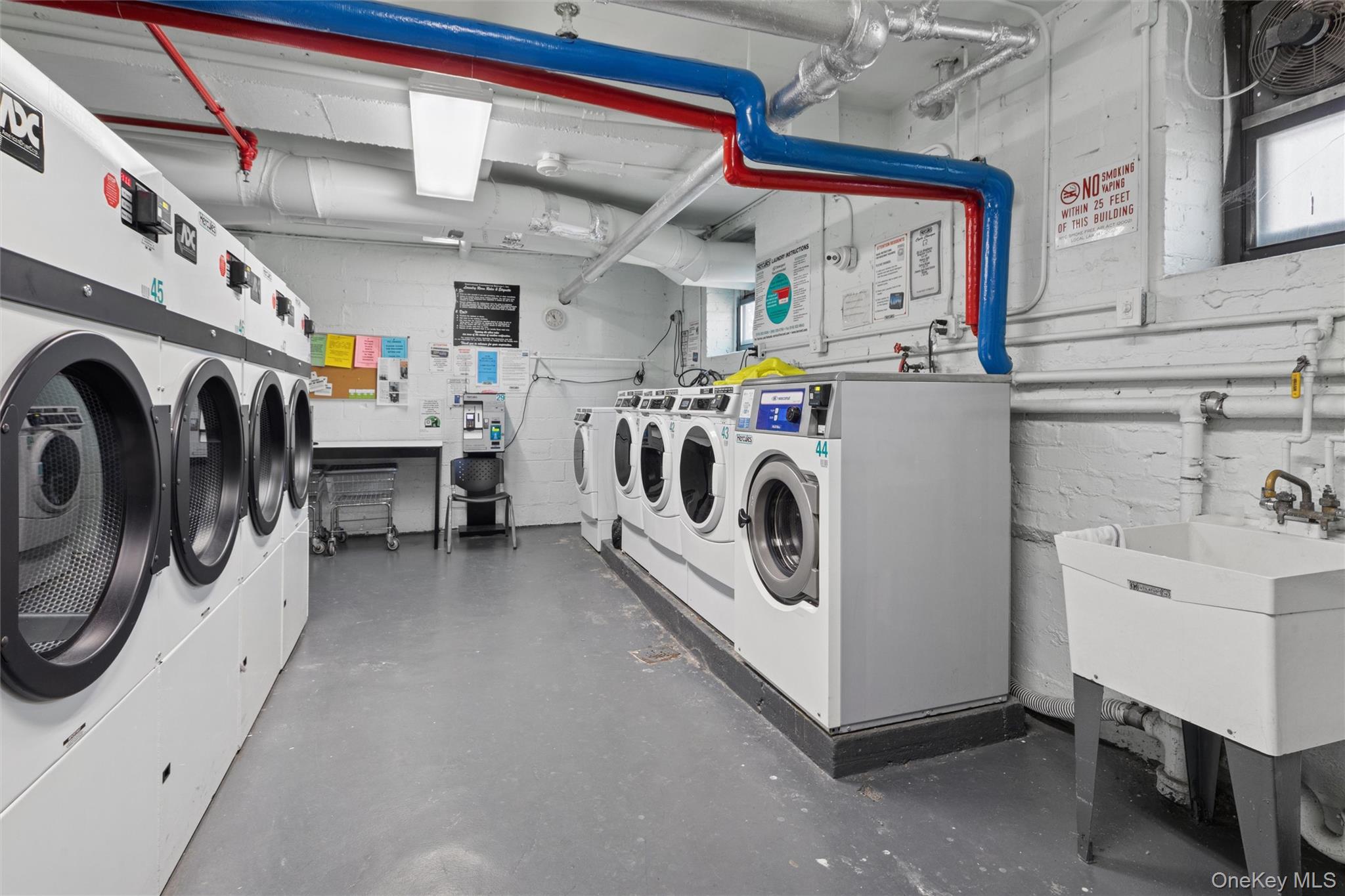 32-40 92nd Street, Unit 107 Queens, NY 11369 - Photo 13 of 16 a utility room with dryer and washer
